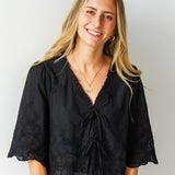 Intricately Defined Tie Top