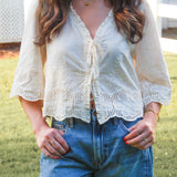 Intricately Defined Tie Top